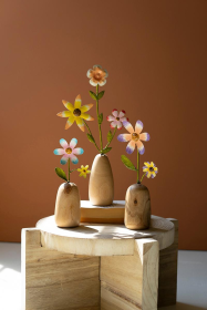 SET OF THREE PAINTED METAL FLOWERS WITH WOODEN BASES